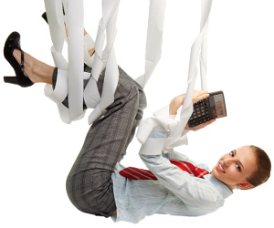 Suspended business woman clutching calculator