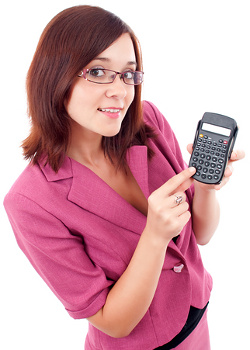 Smart smiling business woman with a calculator